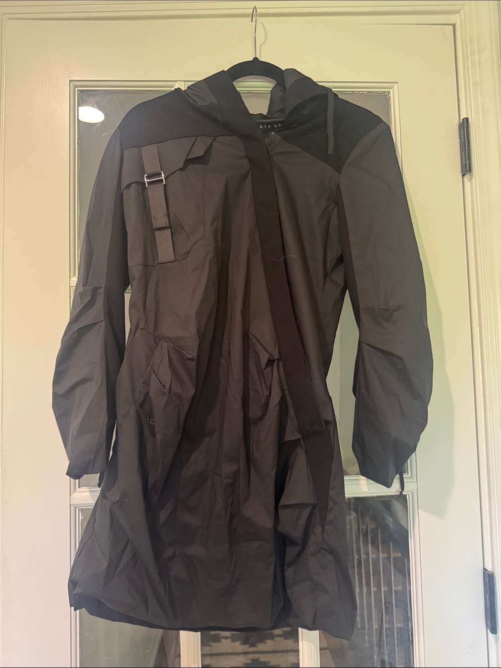 Shin Choi Black Hooded Raincoat with Buckle Detail asymmetrical style